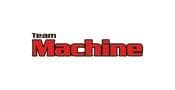 Logo with the words Team Machine in bold text; Team is in small black letters, and Machine is in large red, blocky letters with a black outline, all on a white background.