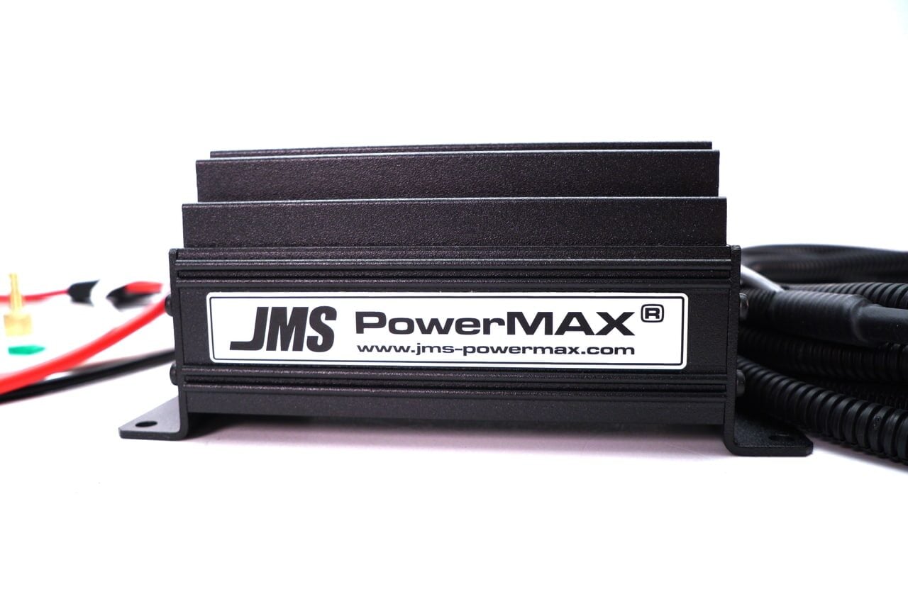 Black JMS PowerMAX electronic device with cooling fins, labeled JMS PowerMAX www.jms-powermax.com, shown with wiring and connectors against a white background.