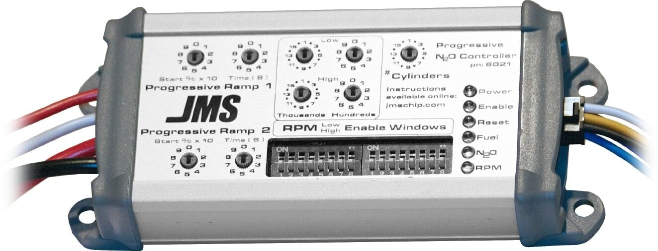 A JMS Progressive Nitrous Oxide (Nâ‚‚O) Controller with dials, switches, indicator lights, and labeled wiring for managing RPM, enable windows, fuel, and Nâ‚‚O settings.