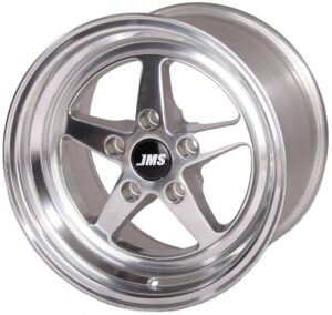 A polished, silver alloy car wheel rim with a five-spoke design and the letters JMS in white on a black center cap. The rim has a shiny, reflective surface and detailed edges.