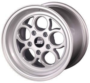 A silver alloy car wheel rim with a multi-spoke, circular hole design and a black center cap featuring the letters JMS in white.